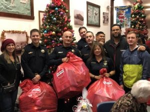 sonitrol security team giving out christmas presents